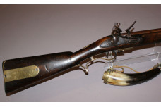 A scarce British Military issue flintlock Baker rifle with brass mounted Powder Horn